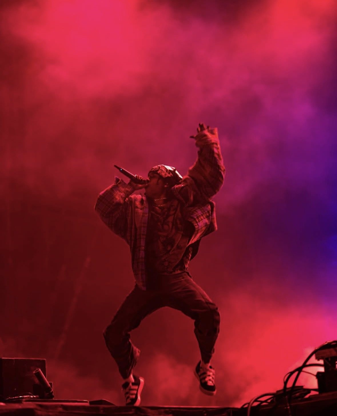 Silhouetted rapper in red and purple haze