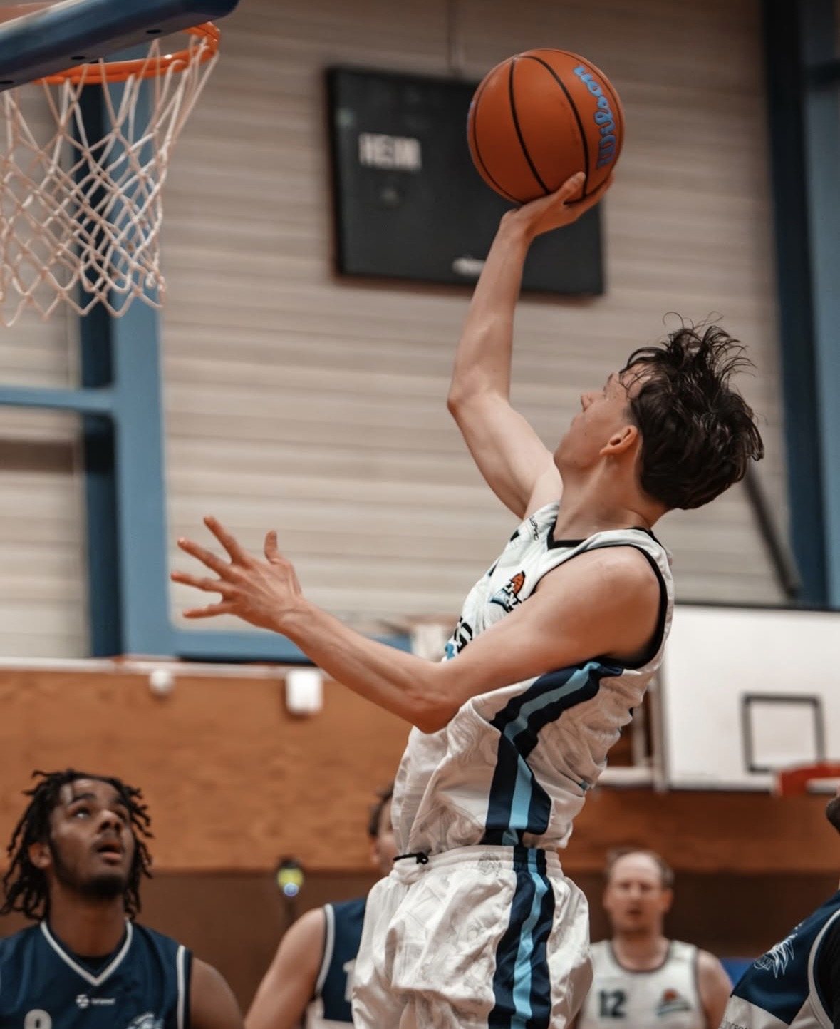 Player releasing a layup at the rim