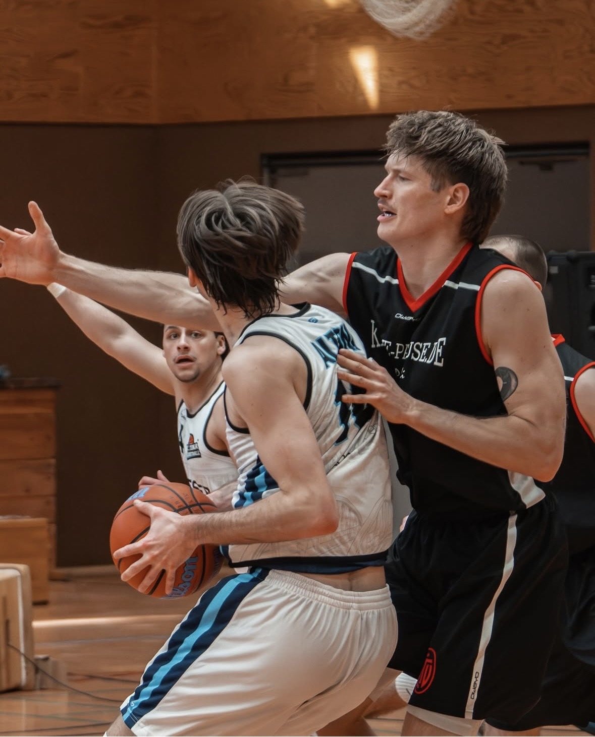 Two players contesting possession